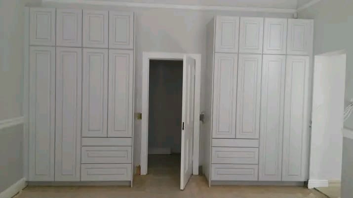 Pair of classic panelled built-in wardrobes